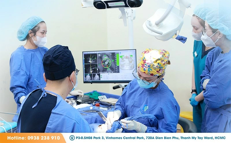 The DCARER AI-guided navigation system in use during implant placement surgery at Dr. Care Implant Clinic. The system directs the surgical handpiece in real time against a pre-planned 3D model, reducing positional deviation and ensuring each implant is seated at the confirmed depth, position, and angulation.