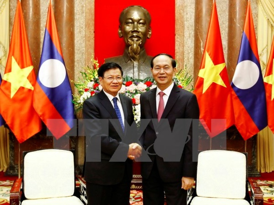 president vietnam gives top priority to boosting ties with laos