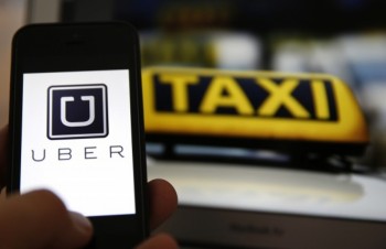 Traditional taxi firms turn to technology