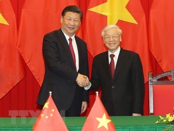 Vietnamese Party General Secretary and State President Nguyen Phu Trong (R) and Chinese Party General Secretary and State President Xi Jinping (Photo: VNA)