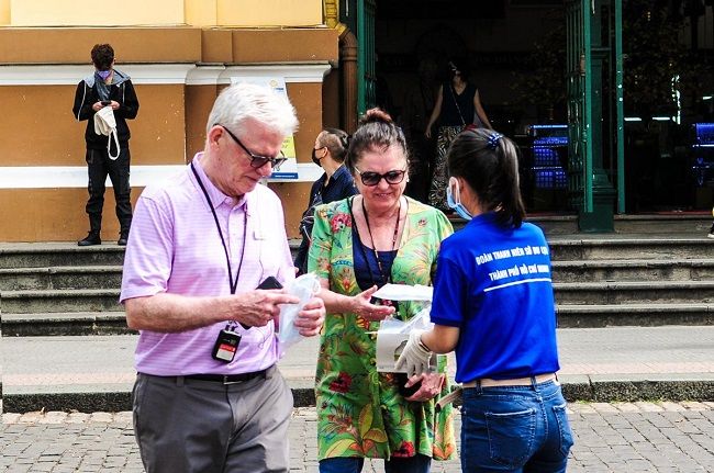 hcmc hands out 100000 free face masks to tourists
