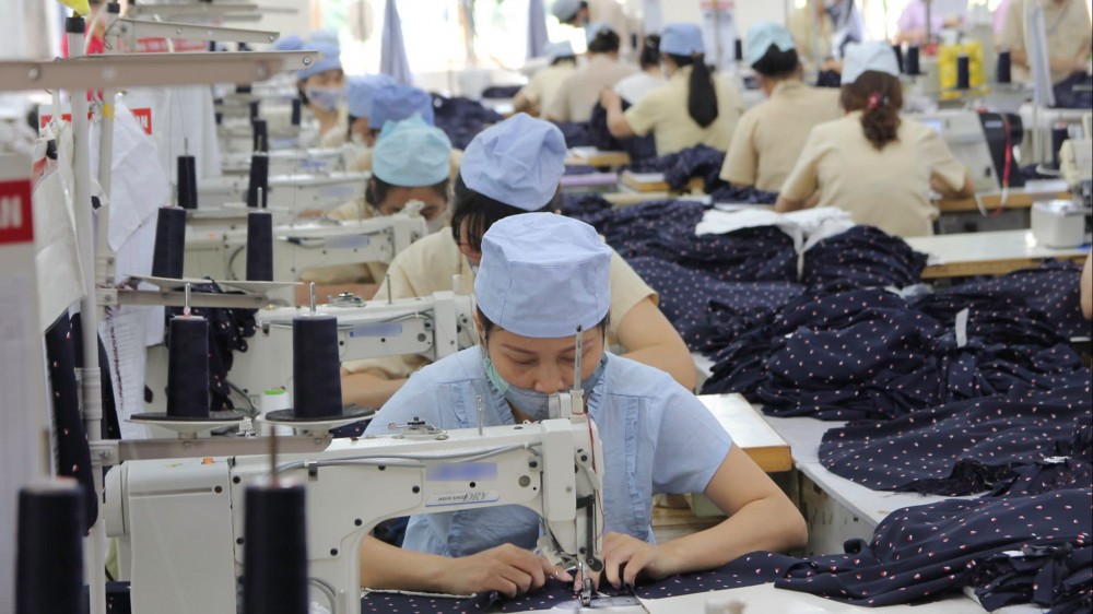 Garment workers seen at a factory in Haiphong: Vietnam now has the fourth-largest trade surplus against the U.S. (Photo courtesy of the International Labour Organization)