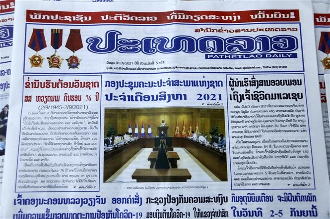 The PathetLao Daily on September 1 publishes on its front page an editorial congratulated Vietnam on its impressive development journey on the occasion of Vietnam's National Day (September 2). (Photo: VNA)