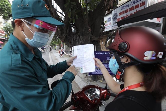 Hanoi tightens control of travel permits during social distancing