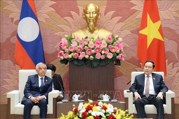 National Assembly Standing Vice Chairman Tran Thanh Man hosts a reception for his visiting Lao counterpart Sommad Pholsena, who also serves as Chairman of the Lao Committee for Peace and Solidarity, in Hanoi on October 5. (Source: VNA)