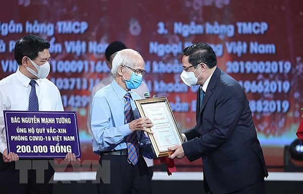 Viet Nam's COVID-19 vaccine fund initiative to be praised by international organisations’ representatives
