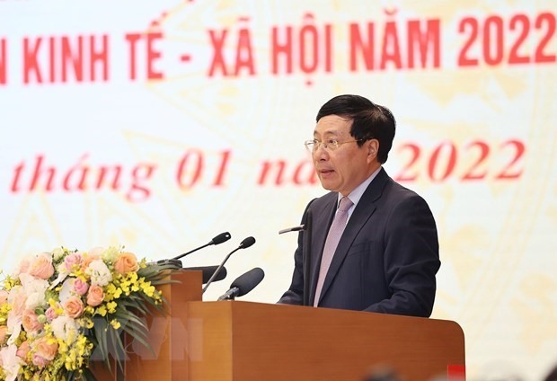 Standing Deputy Prime Minister Pham Binh Minh speaks at the event. (Photo: VNA)