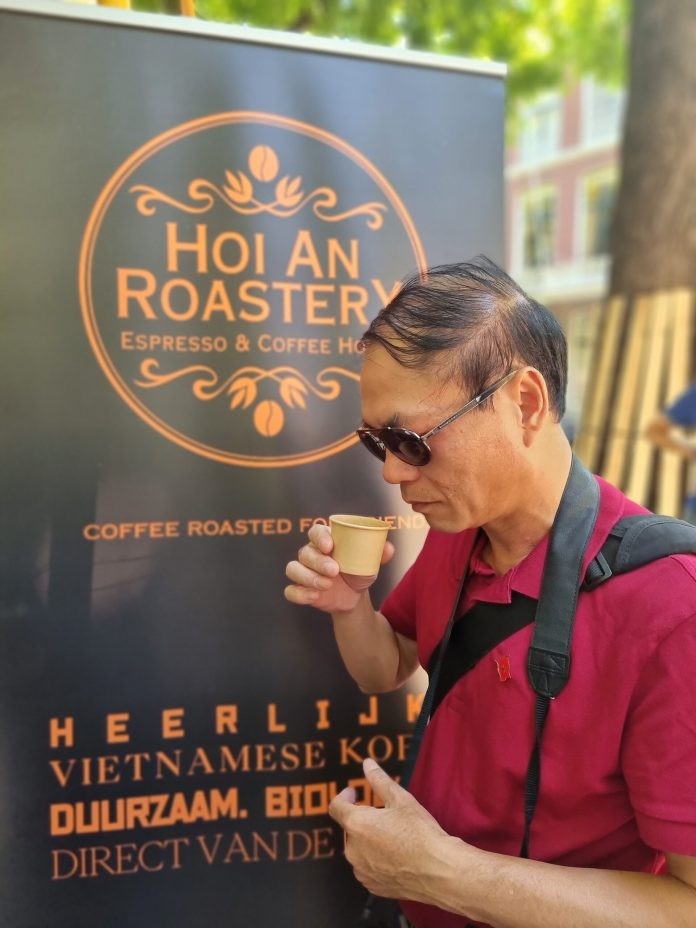 Pham Viet Anh, Ambassador of Viet Nam tasting Vietnamese coffee at Embassy Festival.