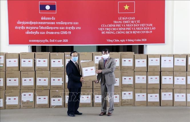 vietnam hands over medical supplies to help laos fight covid 19