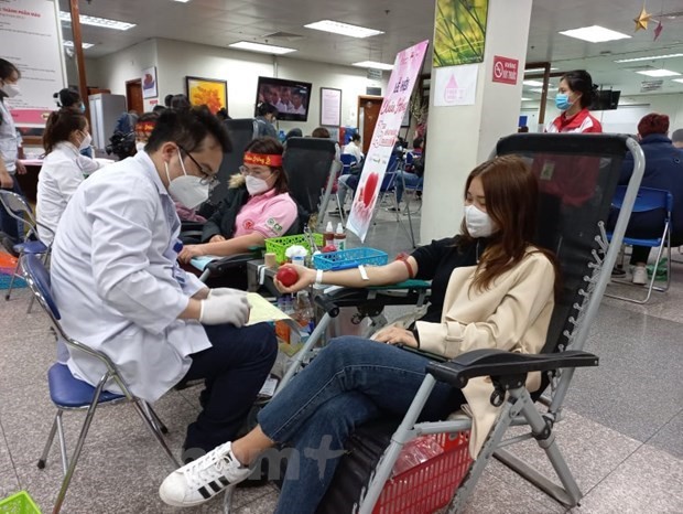People donate blood at the Red Spring Festival on February 12. (Photo: VNA)