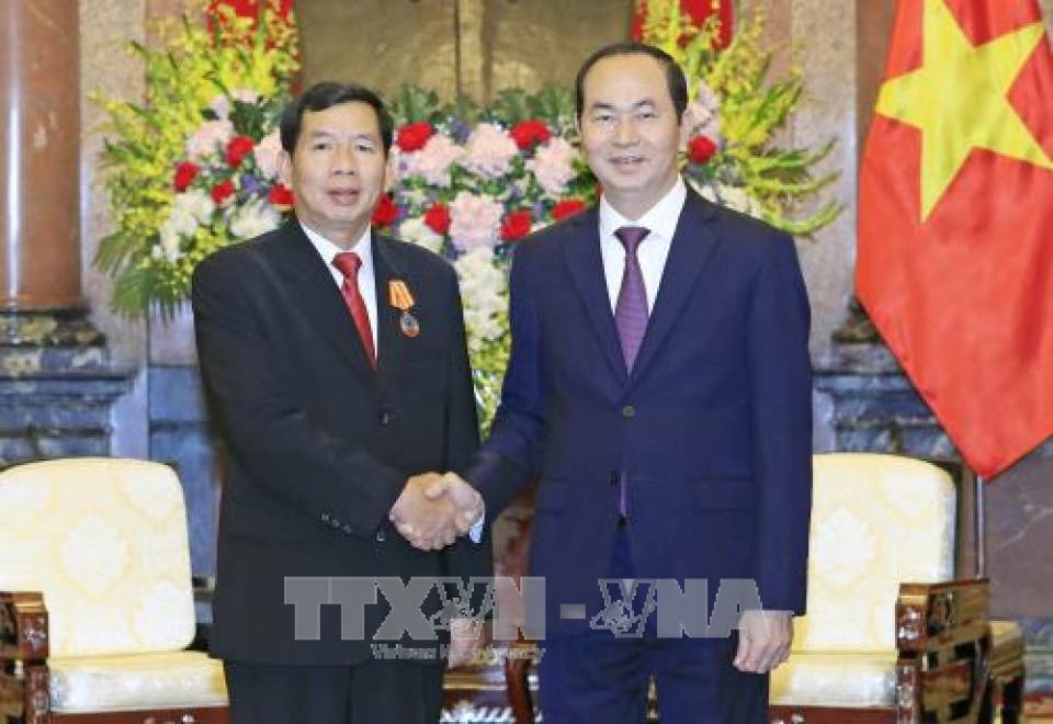 president tran dai quang receives lao supreme court chief