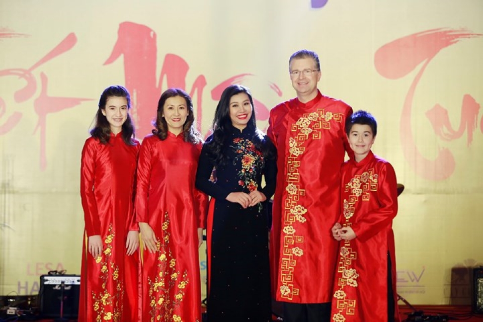 us ambassador his family wear red ao dai to embassy tet event