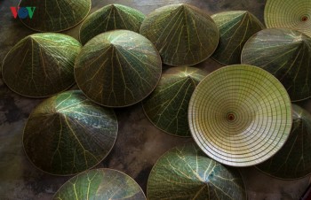Lotus leaf conical hat making at craft villages in Hue