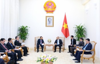 PM looks to maintain high-level visits between Vietnam, Laos