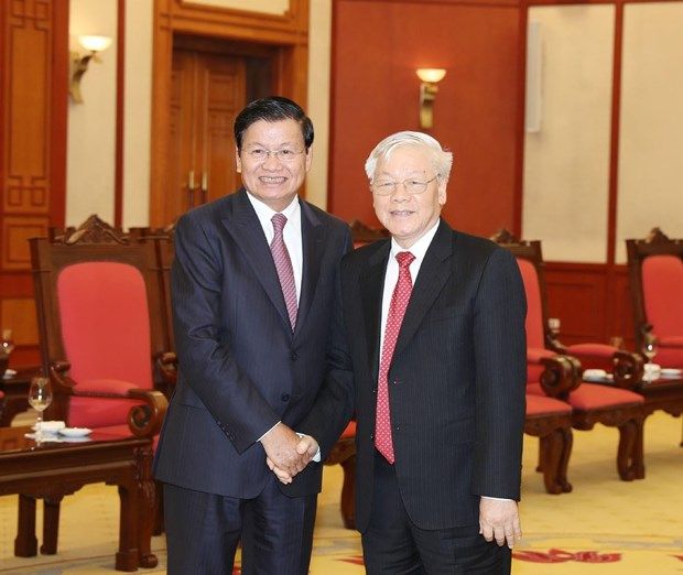 top leader welcomes lao pm in ha noi