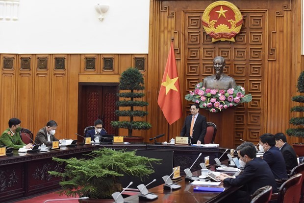 Prime Minister Pham Minh Chinh (standing) chairs the meeting on March 2 (Photo: VNA)