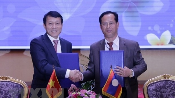 Viet Nam, Laos enhance security collaboration