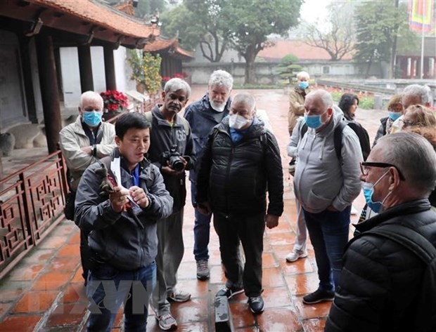 Foreign visitors to the Temple of Literature in Hanoi. (Photo: VNA)