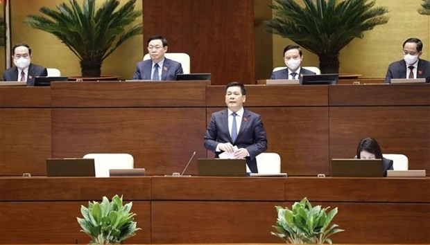 Minister of Industry and Trade Nguyen Hong Dien replies to questions at the 9th sitting of the National Assembly Standing Committee on March 16. (Photo: VNA)