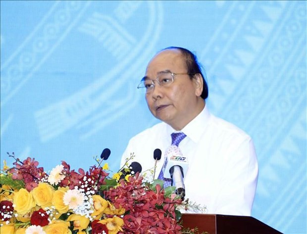 President Nguyen Xuan Phuc addresses the national conference in HCM City on March 17. (Photo: VNA)