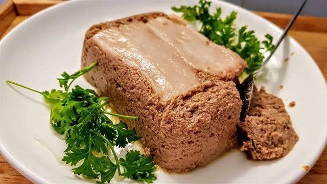FRENCH TRADITION: pa tê, finely ground pork and liver, serves well as a stuffing for Vietnamese crispy loaves. (Photo courtesy of the shop)