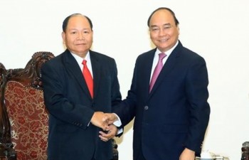PM lauds Vietnam - Laos cooperation in home affairs