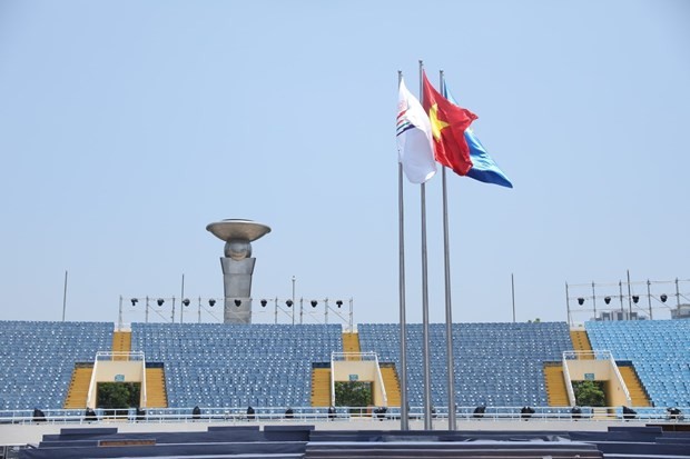 National flag of Vietnam and SEA Games 31 fly at a stadium. (Photo: VNA)