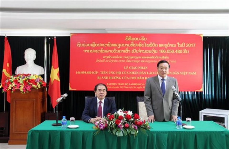 laos provides financial relief for typhoon hit people in vietnam