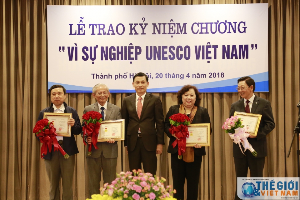 20 individuals presented with unesco vietnam insignia