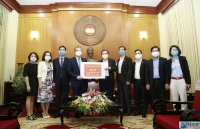 deputy fm dang minh khoi handed 46 billion vnd of overseas vietnamese to support covid 19 fight in homeland